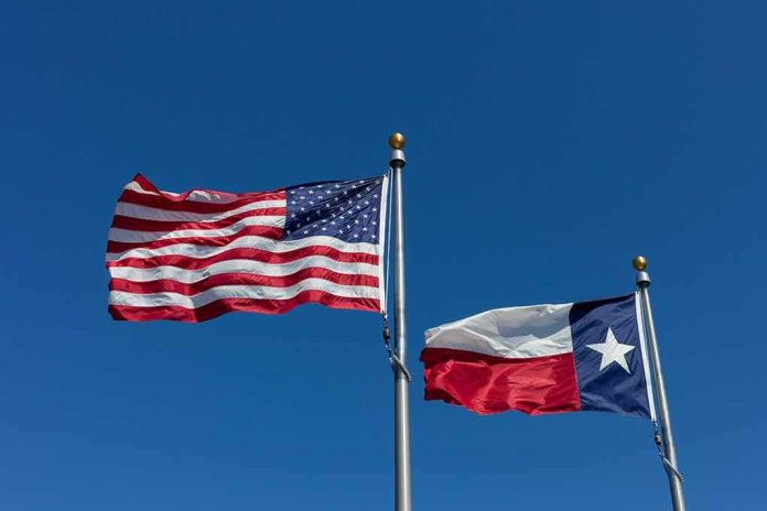 American and Texas flags waving on flagpoles