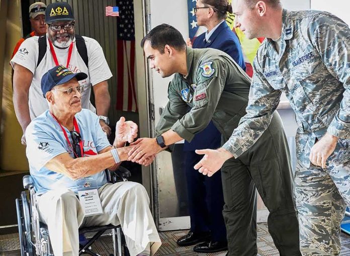 shutterstock_1538865953 Veteran in wheelchair greeted by military personnel at event