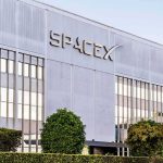 Musk’s Wild Gift: One Share Each Child? SpaceX headquarters exterior with large logo and windows