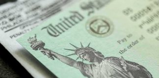 Obamacare Fee SURPLUS – Money Flows Back U.S. Treasury check with Statue of Liberty illustration