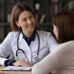 Gene Match Magic – Or Expensive Mirage? Doctor speaking with patient at desk