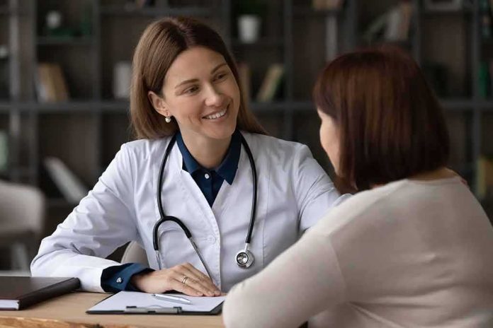 Doctor speaking with patient at desk