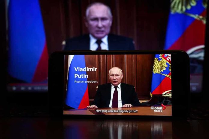 shutterstock_2127643805 man giving televised speech on smartphone screen