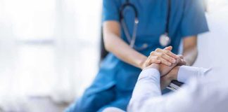 Psilocybin Shock: Memory Flickers Back Nurse comforting a patient by holding hands