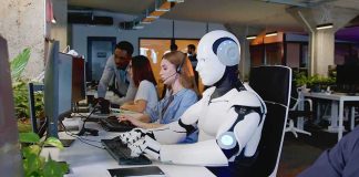 Bill Gates’ Robot Tax Gambit Sparks Firestorm Robot and office workers at computers in a modern workspace