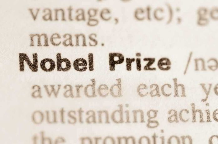 shutterstock_264333239 Nobel Prize text highlighted in a dictionary