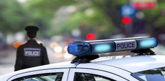 Unsealed Video Upends CEO Murder Case police car roof with blue emergency lights